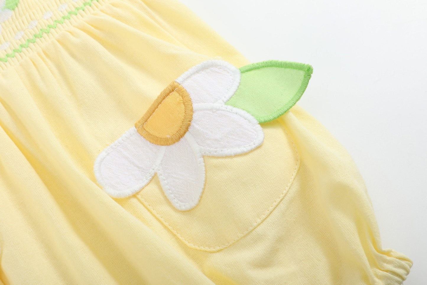 Yellow Daisy Pocketed Smocked Flutter Romper